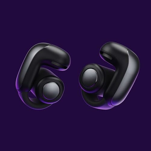 Black wireless earbuds on a purple background