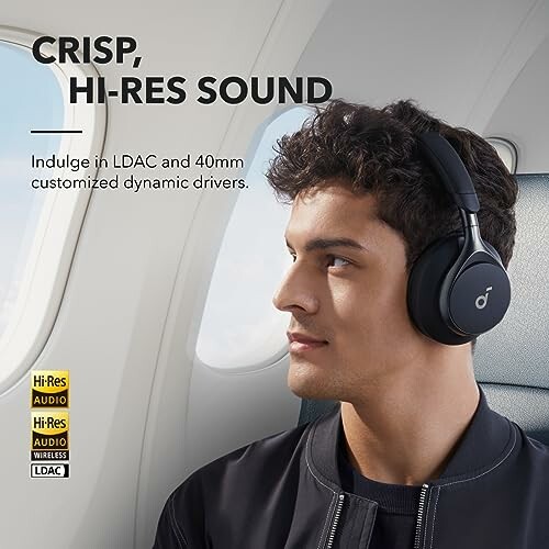 Person wearing headphones on an airplane with text promoting high-resolution sound.