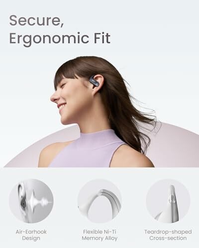 Woman wearing secure ergonomic earbuds with air-earhook design and teardrop-shaped cross-section.