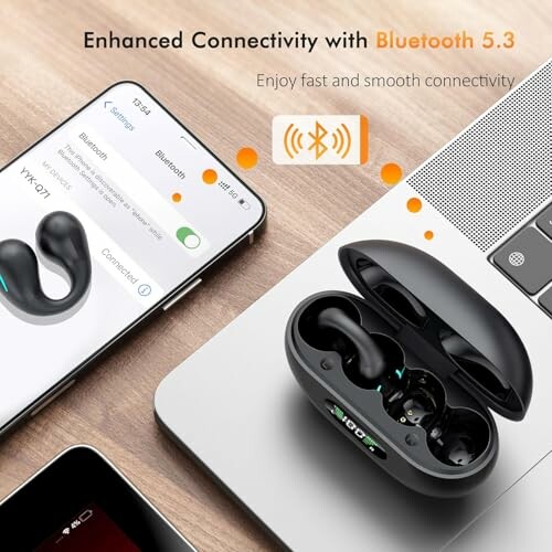 Wireless earbuds with Bluetooth 5.3 next to a laptop and smartphone.