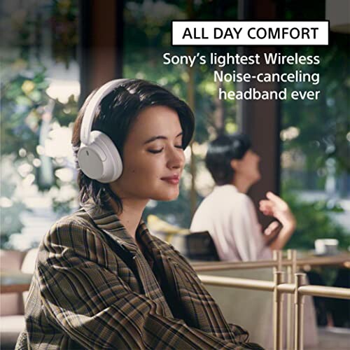 Person enjoying music with Sony wireless noise-canceling headphones.