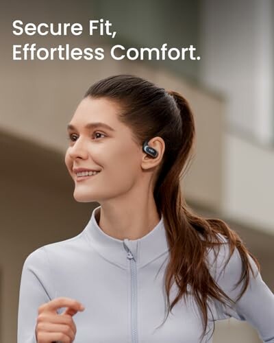 Woman wearing earbuds with secure fit and effortless comfort.