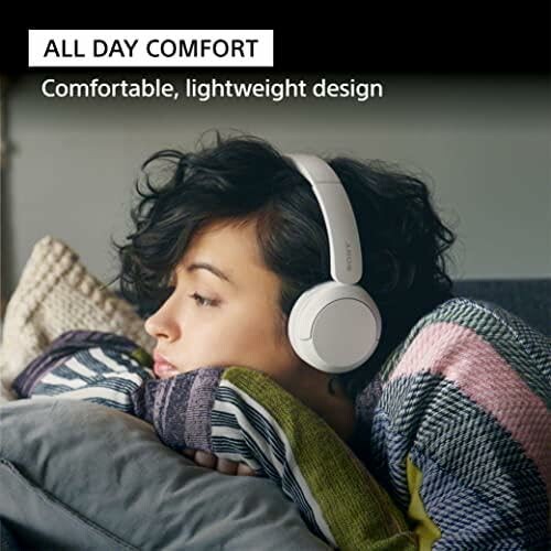 Woman wearing headphones with text 'All Day Comfort. Comfortable, lightweight design.'