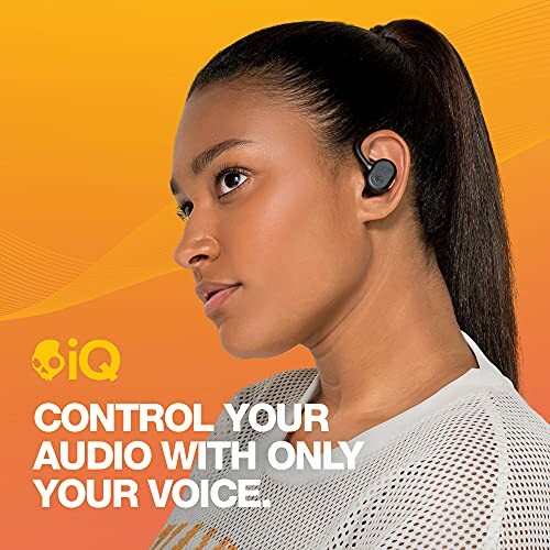 Woman using wireless earbuds with voice control feature.